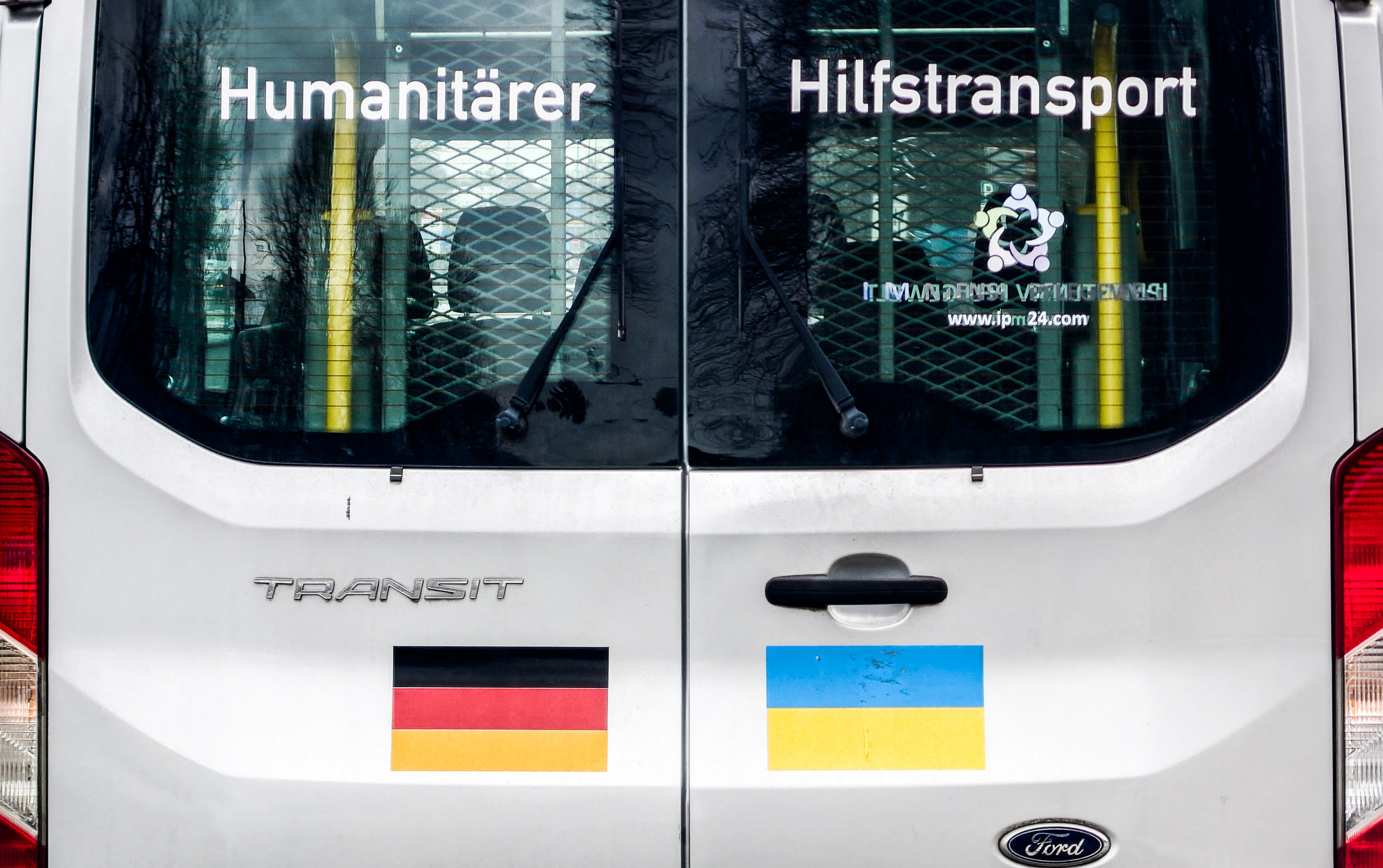 February 27, 2023, Munich, Bavaria, Germany: A van in Munich, Germany is marked with ''Humanitarian Aid Transport'' and the flags of Germany and Ukraine.  Since the outbreak of Russia's full-scale invasion of Ukraine, Germany has been one of the largest s