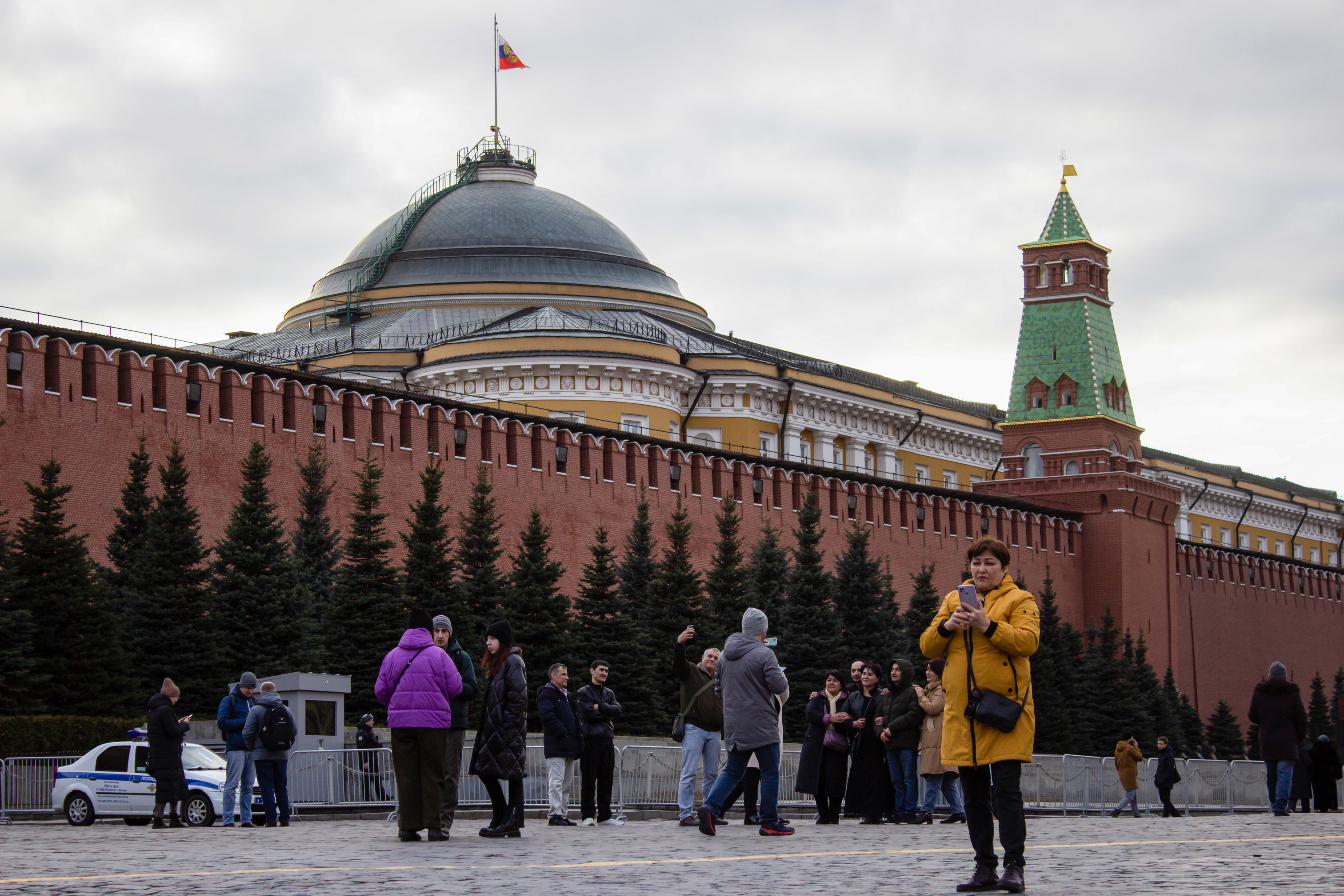 March 22, 2023, Moscow, Russia: People walk on the Red Square next to the Kremlin wall.